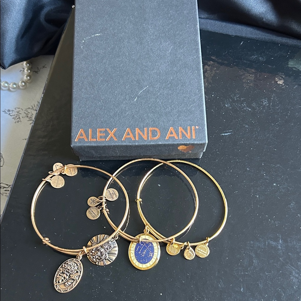 Alex and Ani Gold and Blue Charm Bracelets